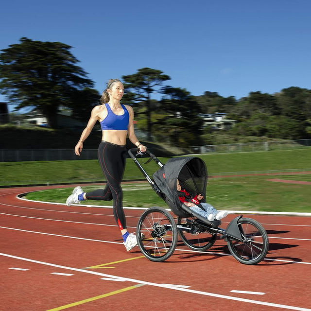 girl running with baby in phil&teds sub 4 running buggy_black